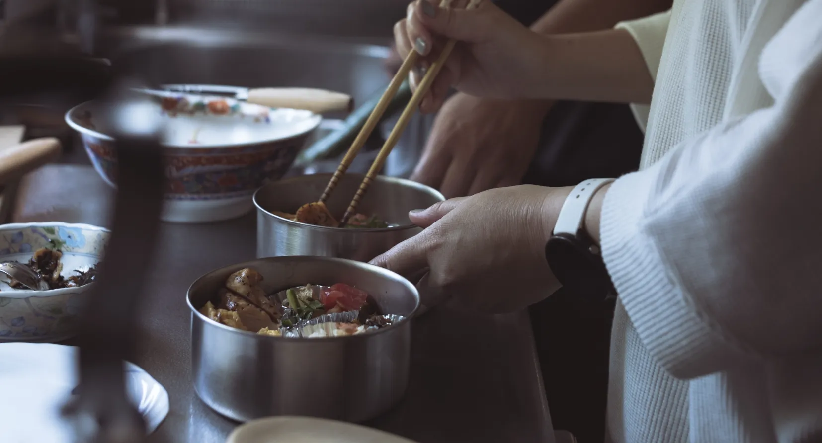 Preparing bento boxes together in the kitchen