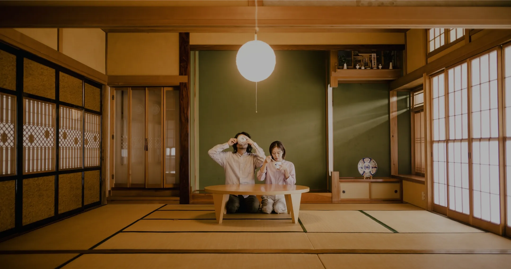 A couple sharing a quiet meal at a low table